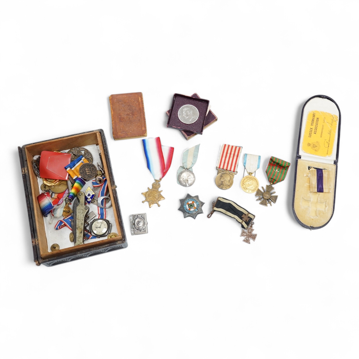 A quantity of assorted medals, an Essex crystal button, badges and ephemera